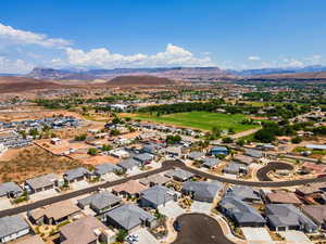 Aerial perspective of suburban area featuring a mountain backdrop