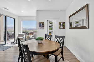 Dining area featuring light wood finished floors and recessed lighting
