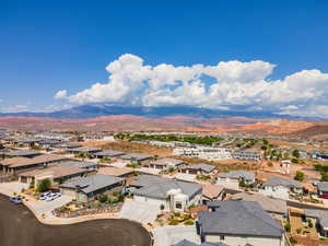 Aerial view of residential area featuring a mountain backdrop