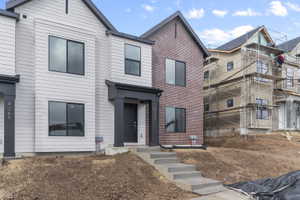 View of front facade with brick siding