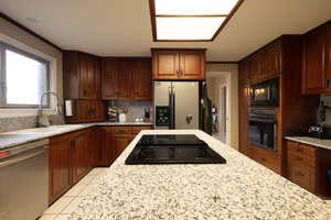 Kitchen with light stone counters
