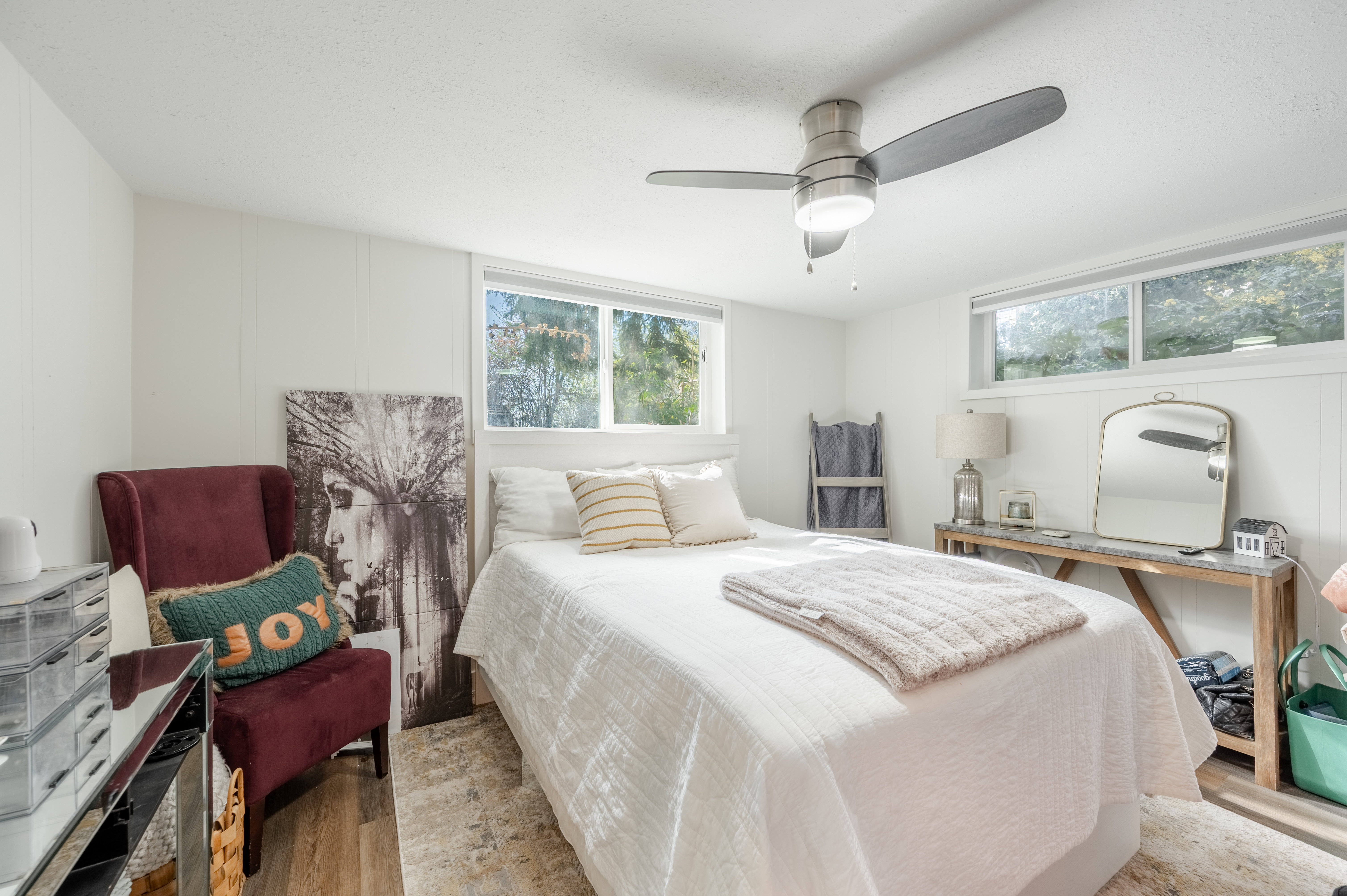 Bedroom with wood finished floors and ceiling fan