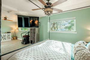 Bedroom featuring wood finish floors and a ceiling fan