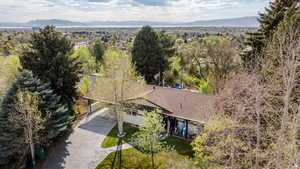 View from above of property featuring mountains and a tree filled landscape