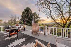 Deck at dusk with outdoor dining area