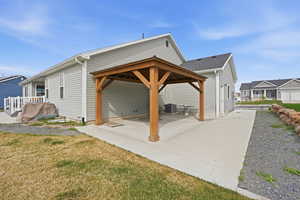 View of side of property with a gazebo, a patio area, and RV space