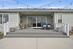 Rear view of house with an over-sized deck