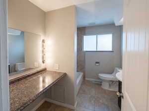 Full bath featuring vanity and light tile patterned floors