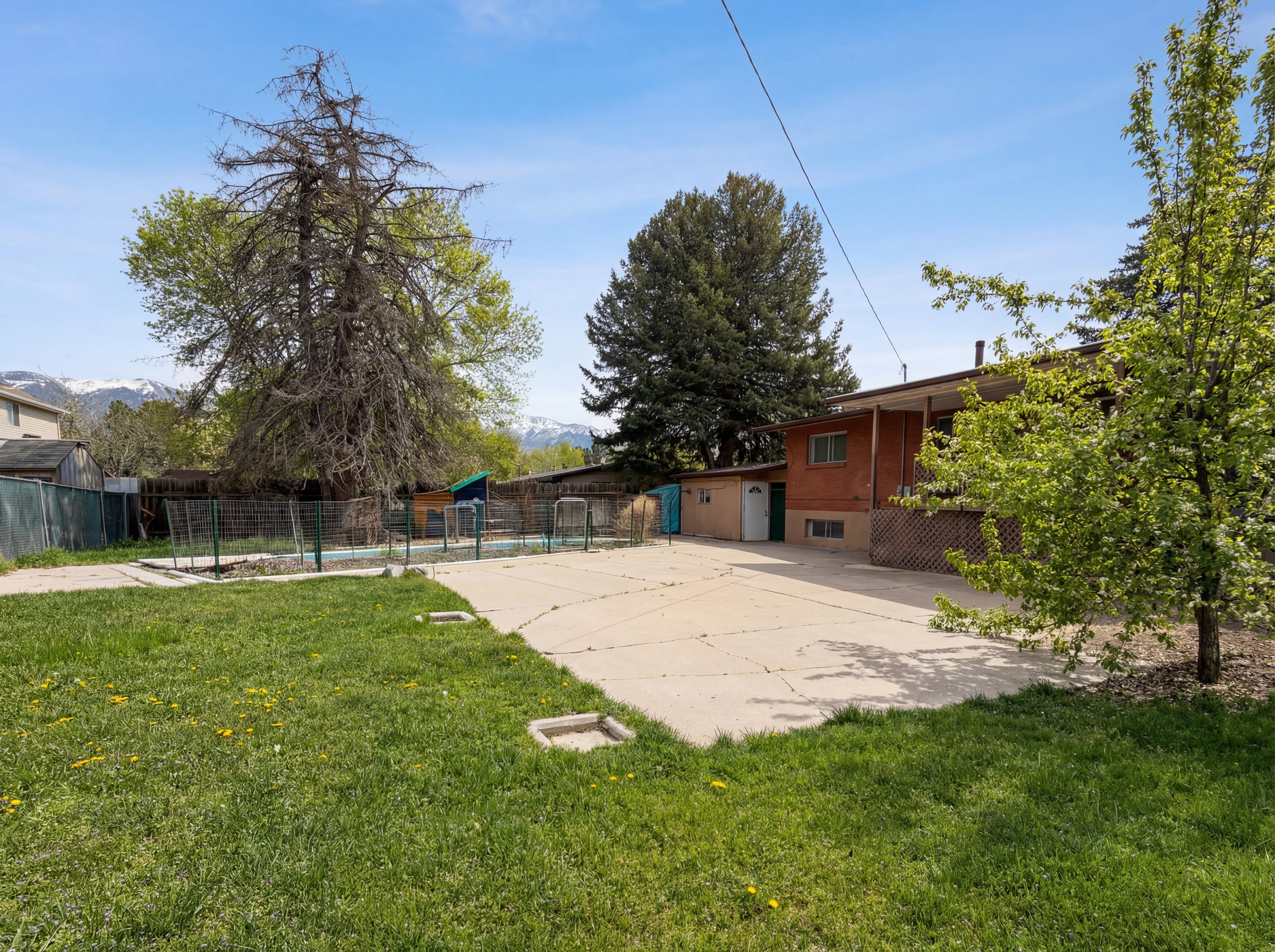 View of yard featuring a swimming pool
