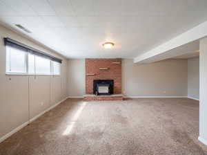 Unfurnished living room with carpet flooring and baseboards