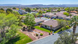 Aerial view of residential area featuring a mountainous background