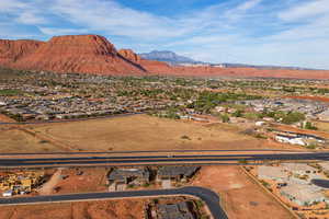 View of mountain backdrop featuring nearby suburban area