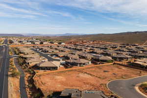Aerial perspective of suburban area with a mountainous background