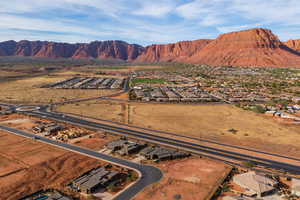 Aerial perspective of suburban area featuring a mountain backdrop