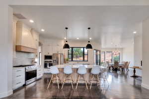 Kitchen featuring Quartz countertops and large island