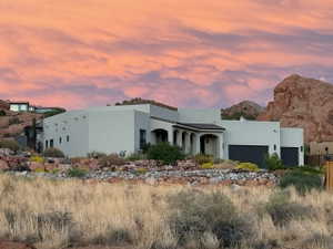 View of front of home with Red Rock backdrop