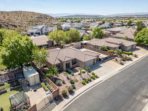 Aerial perspective of suburban area featuring a mountain backdrop