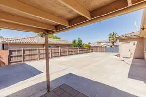 Fenced backyard with a patio area