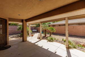 Fenced backyard featuring a patio