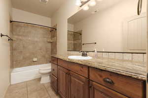 Full bathroom featuring vanity,  shower combination, and light tile patterned floors