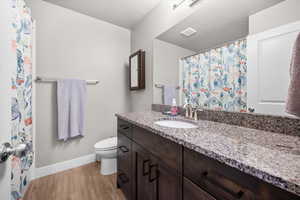 Bathroom with granite vanity, tub/shower, and plenty of counter space.