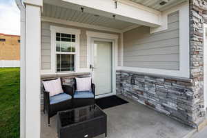 Inviting entrance to property with stone siding.