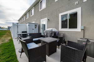 View of patio / terrace featuring an outdoor lounge area and a grill.