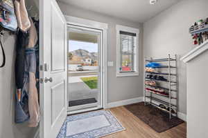 Entrance foyer with glass door and mountain view.