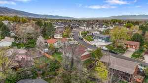 Aerial view of residential area featuring a mountainous background