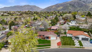 Aerial perspective of suburban area with a mountain backdrop