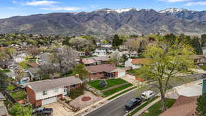Aerial view of residential area featuring a mountainous background