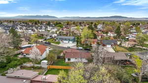 Aerial perspective of suburban area with a mountainous background
