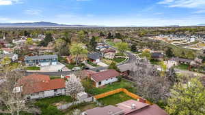 Aerial perspective of suburban area featuring a mountain backdrop