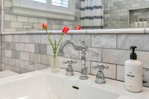 Master bath has high-end fixtures and beautiful tilework