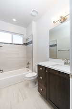 Bathroom featuring vanity and shower / bathtub combination