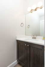 Bathroom featuring vanity and light wood-type flooring