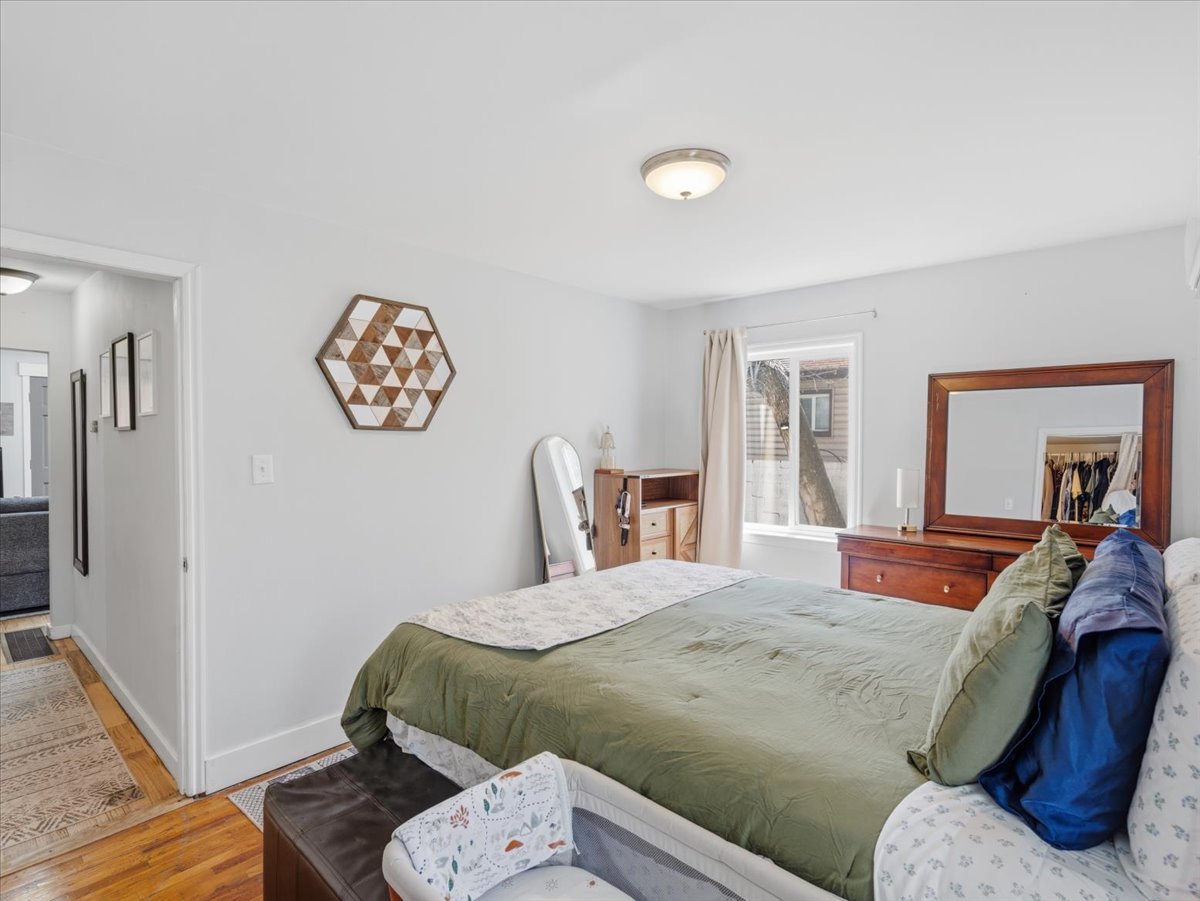 Bedroom featuring baseboards and light wood-style flooring