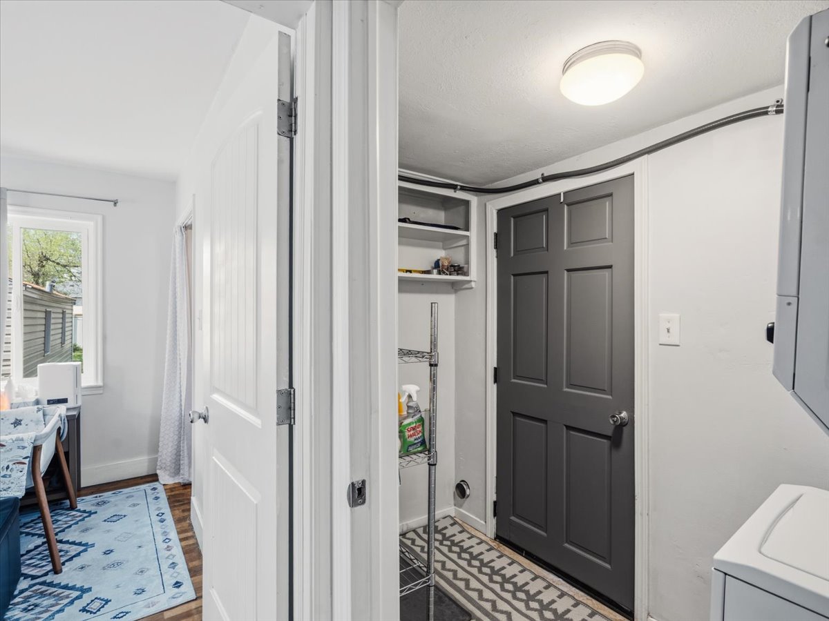 Laundry room featuring washer / dryer and light wood finished floors