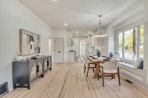 Dining area featuring light wood-style floors and recessed lighting