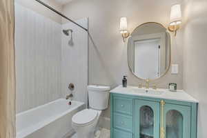 Full bath with vanity and shower / bath combo with shower curtain