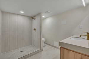 Bathroom with vanity and a shower stall