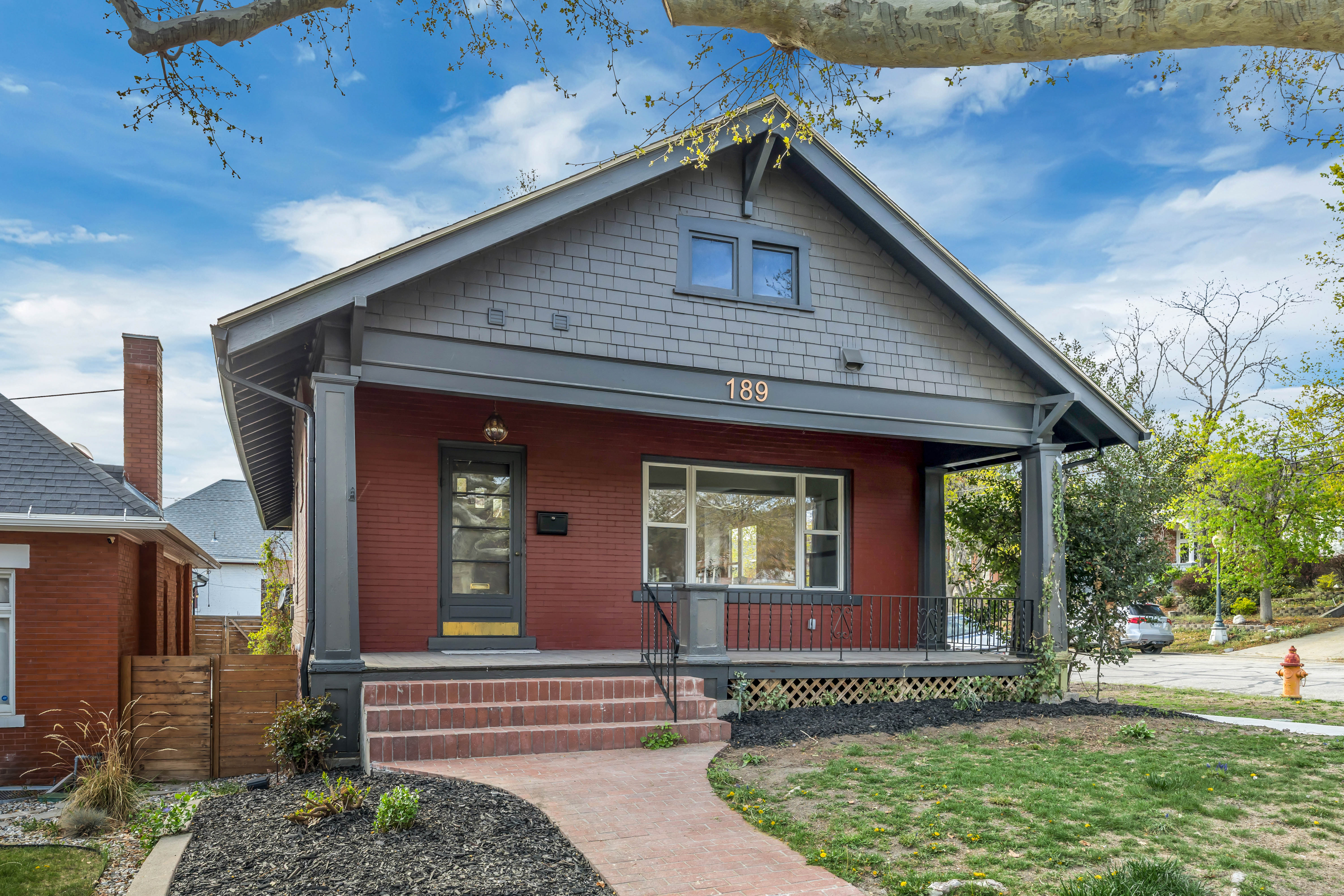 View of front facade featuring a porch and a front lawn