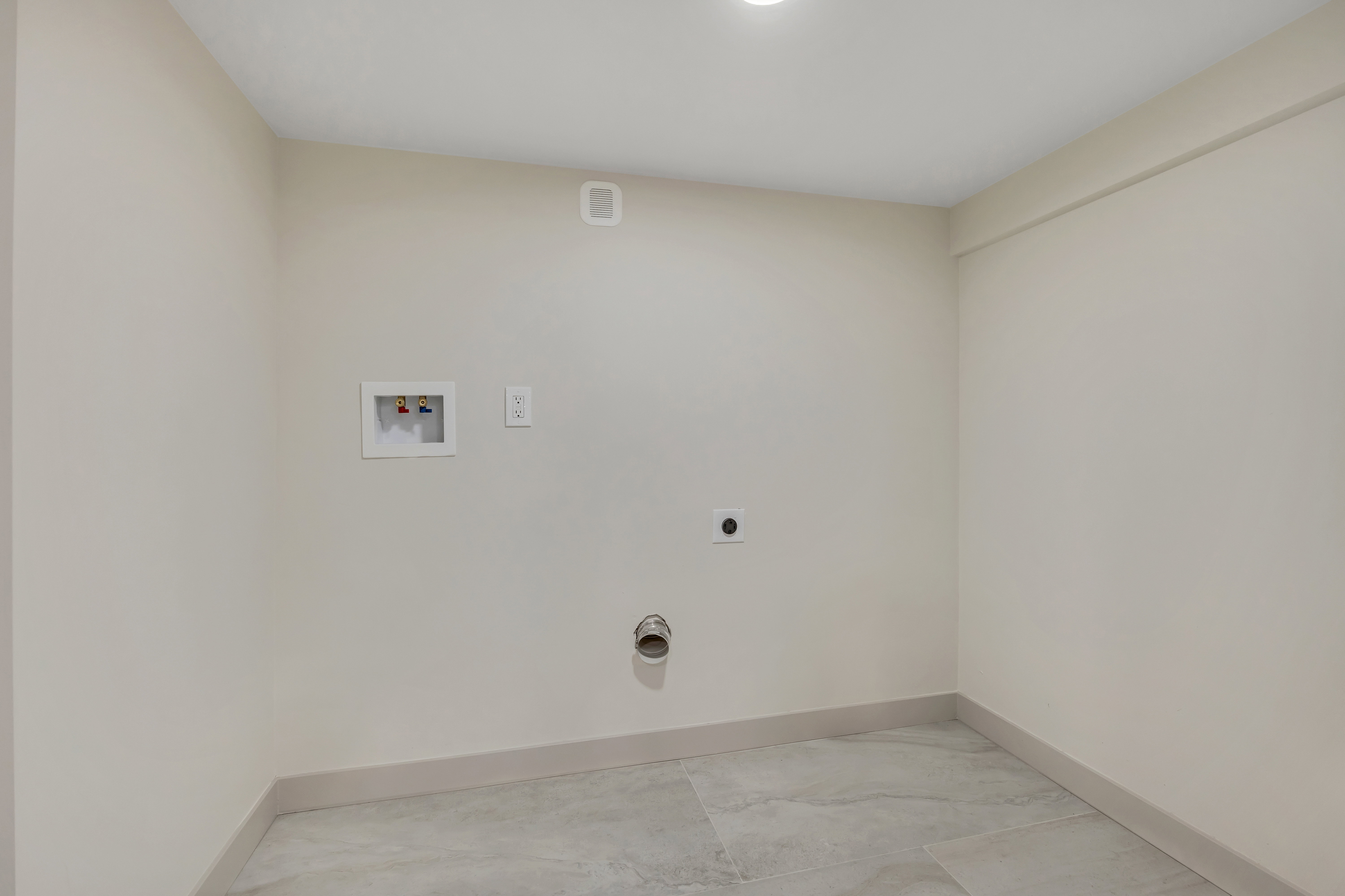 Laundry area featuring hookup for a washing machine and hookup for an electric dryer