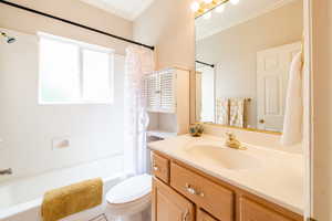Full bathroom with tub/shower, natural light and storage
