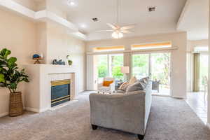Open living room with cozy fireplace and bright natural light