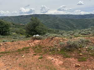 View of mountain background featuring rural landscape
