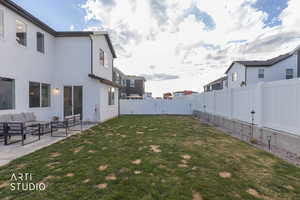 Fenced backyard featuring outdoor lounge area