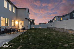 Fenced backyard featuring outdoor furniture