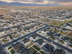 Aerial view of property's location featuring nearby suburban area and a mountain backdrop