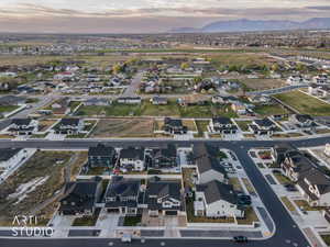 Aerial view at dusk of a residential view and a mountain view